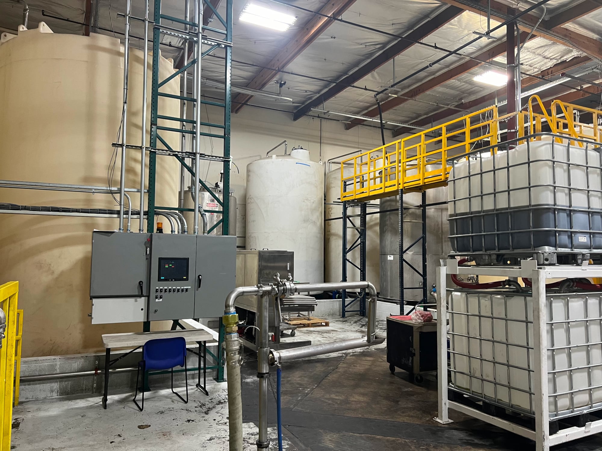 Production Area with Totes and Stainless Steel Tanks for Mixing Cooking Oils